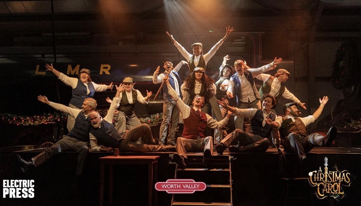 The cast of A Christmas Carol on stage at the Worth Valley Railway